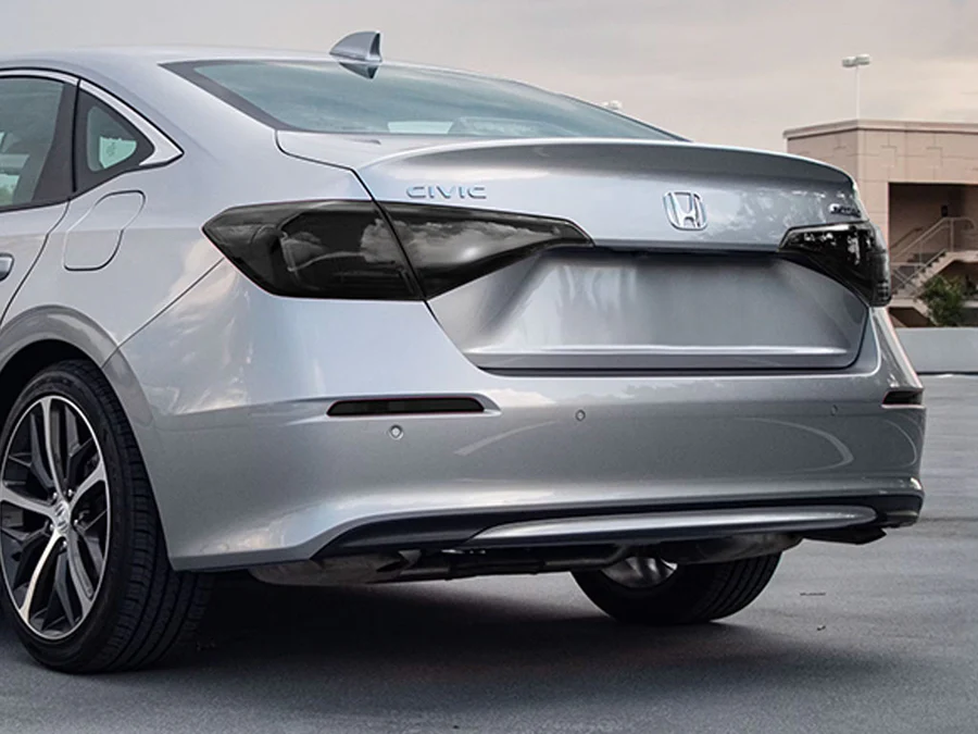 Silver Honda Civic sedan rear view with sleek design and tinted taillights